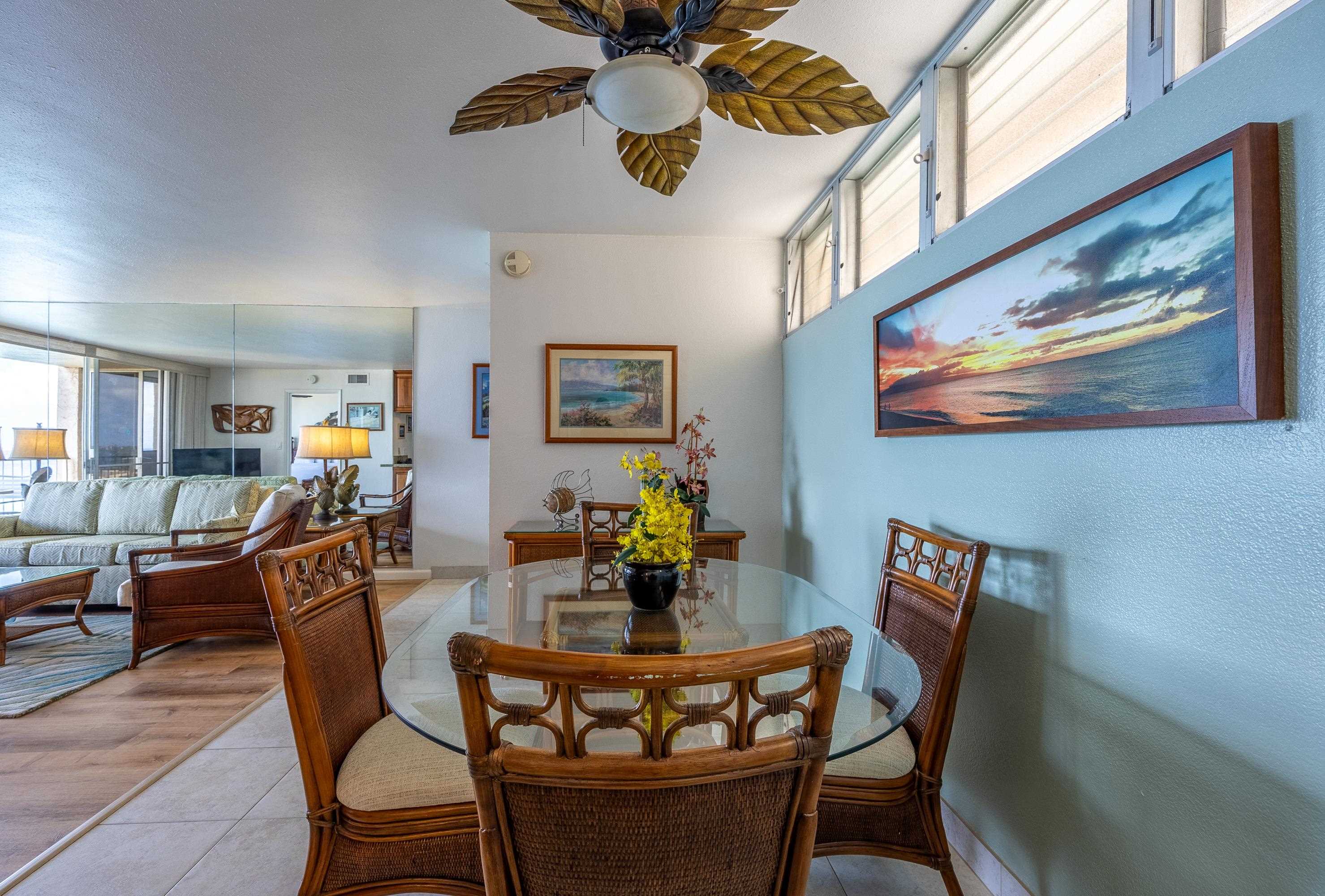 4365 Lower Honoapiilani Road, Unit 1008 Lahaina, HI 96761 - Photo 12 of 31 a dining room with furniture and wooden floor