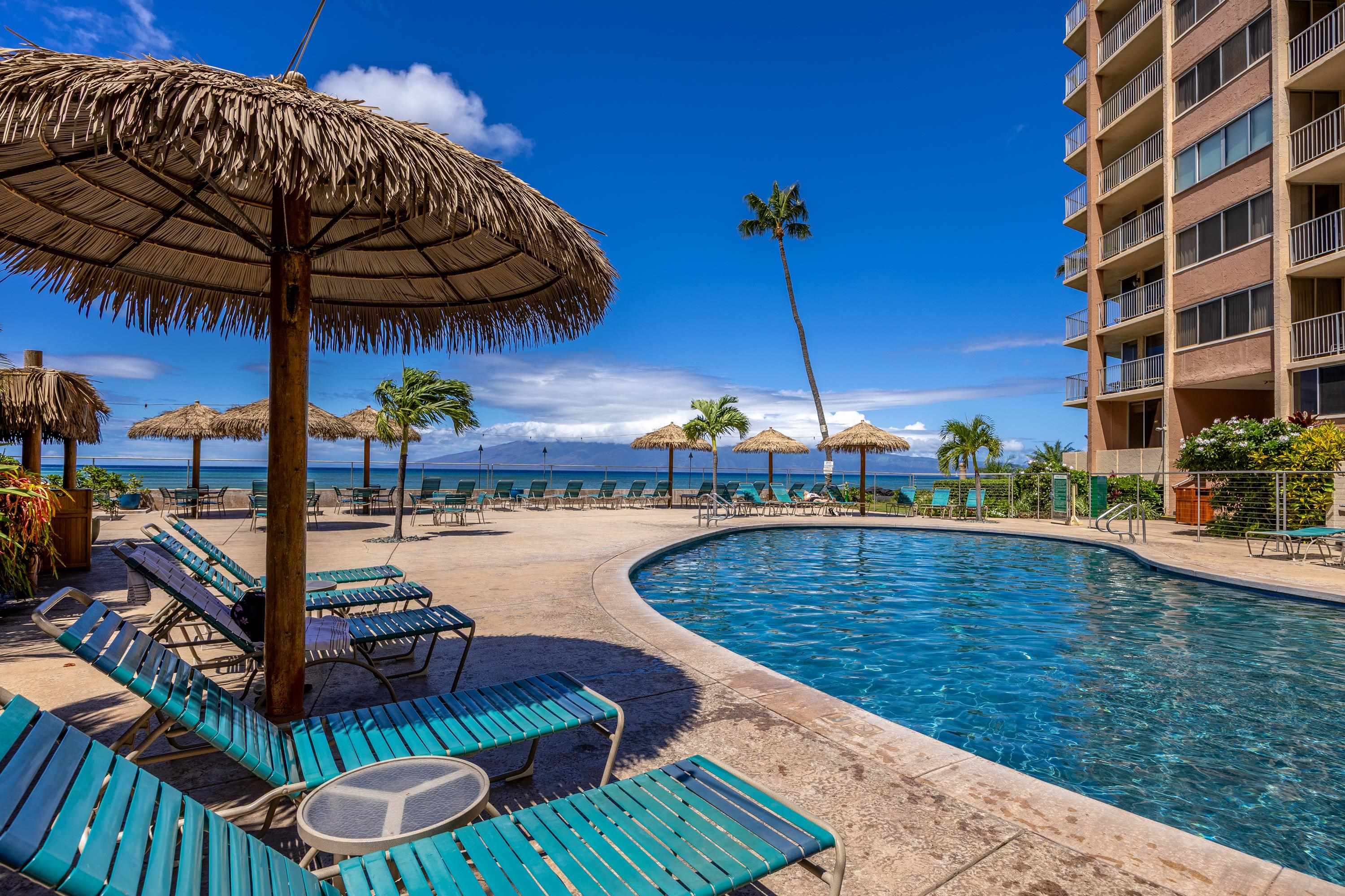 4365 Lower Honoapiilani Road, Unit 1008 Lahaina, HI 96761 - Photo 17 of 31 a view of a swimming pool with a patio