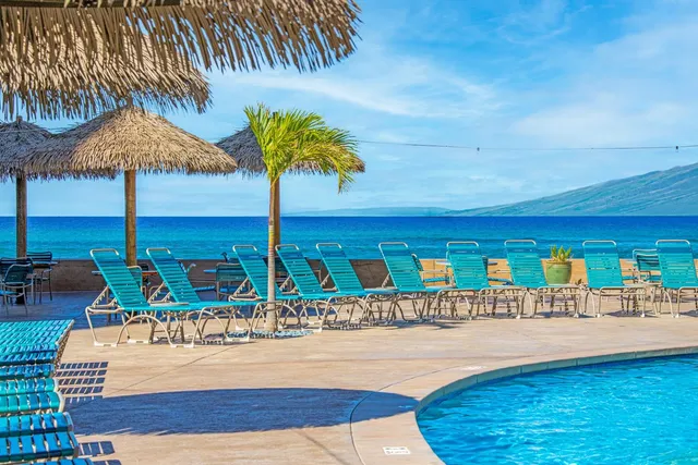a view of a swimming pool with a patio
