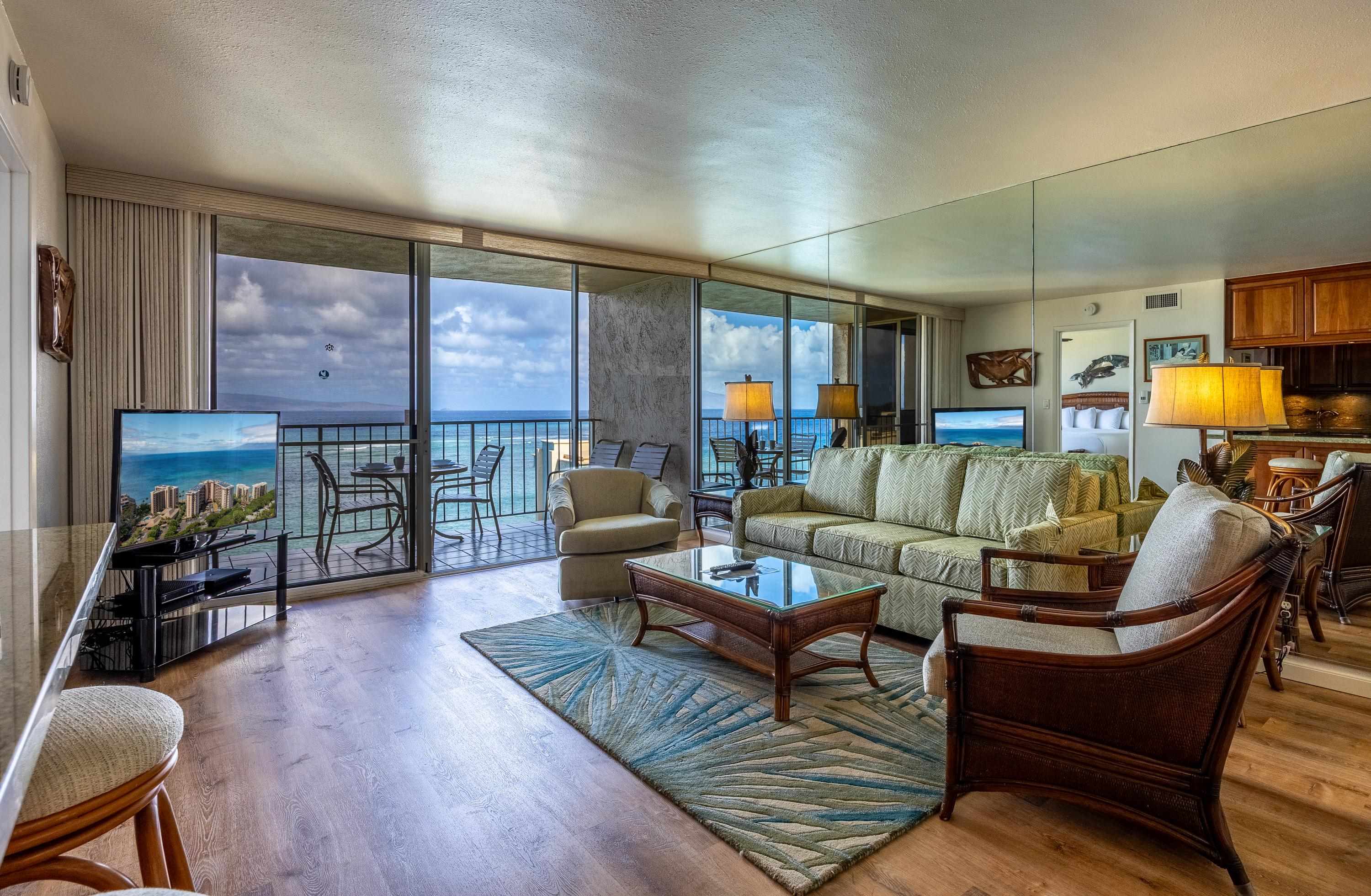 4365 Lower Honoapiilani Road, Unit 1008 Lahaina, HI 96761 - Photo 4 of 31 a living room with furniture and wooden floor