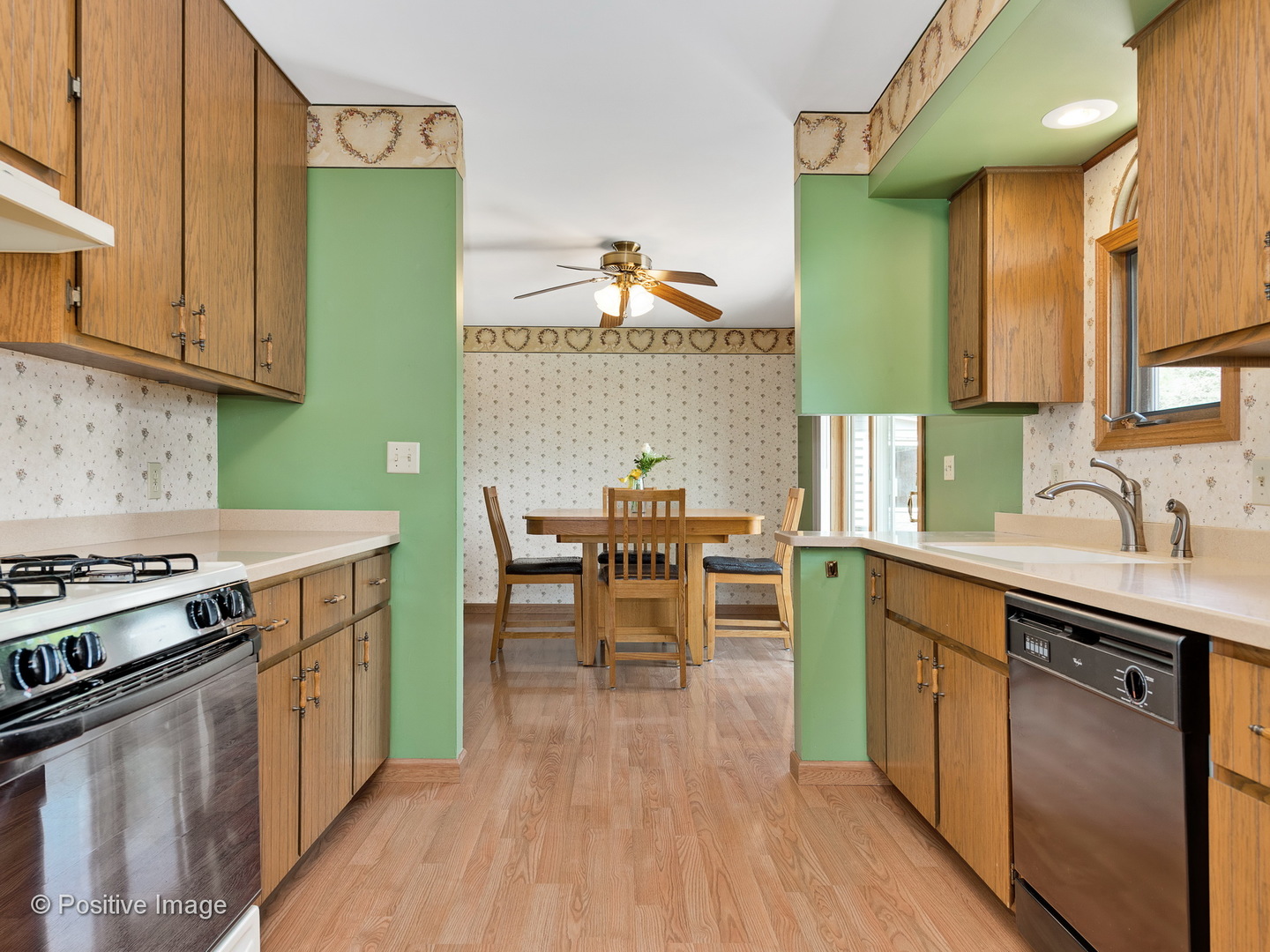 616 South Cooper Road New Lenox, IL 60451 - Photo 8 of 24 a kitchen with a sink cabinets and wooden floor