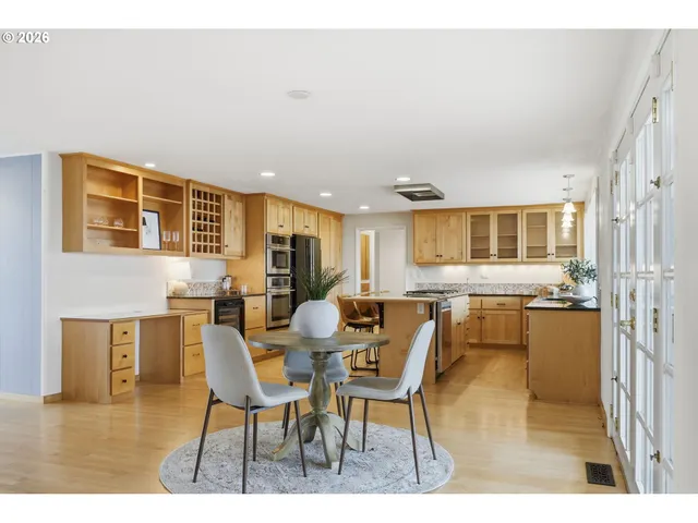 a kitchen with stainless steel appliances granite countertop a refrigerator and cabinets