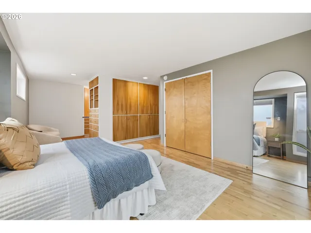 a living room with furniture windows and a walk in closet