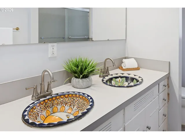 a living room with a bed furniture and a window