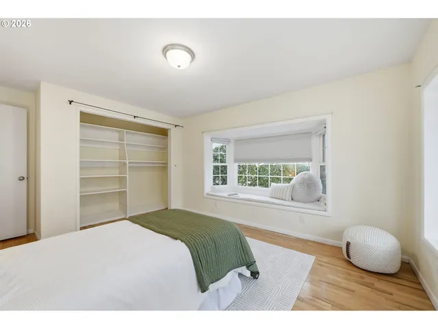 a view of a hallway and a livingroom with furniture