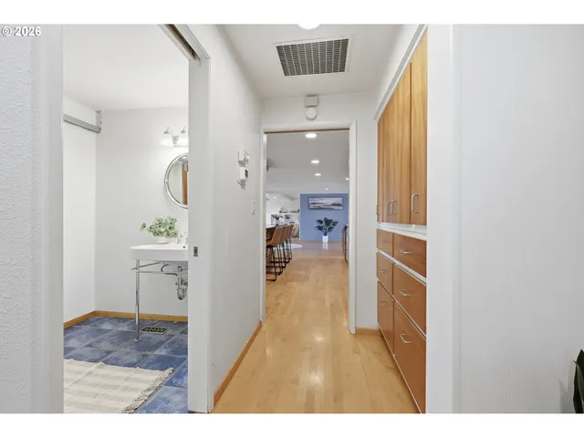 a bathroom with a sink a mirror and a light fixture