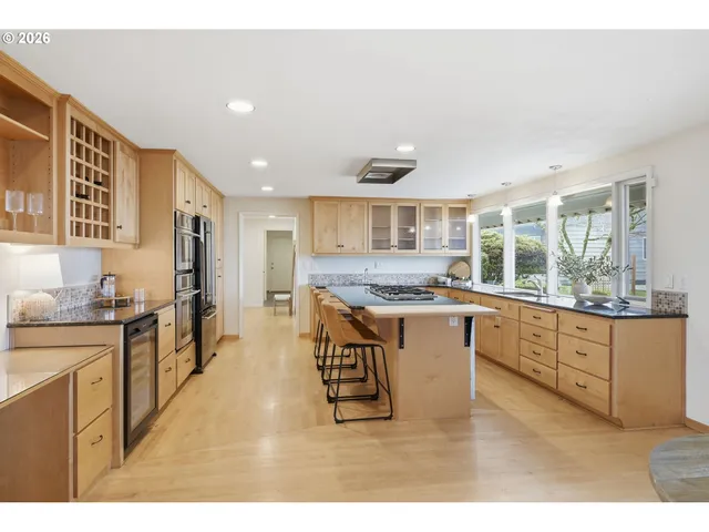 a bedroom with a large bed and a large window