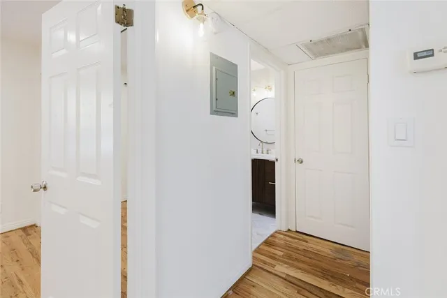 a view of a room with wooden floor and staircase