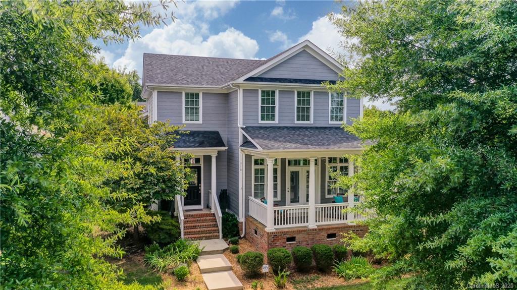 718 Revival Row Fort Mill, SC 29708 - Photo 3 of 47 a front view of a house with a yard and potted plants