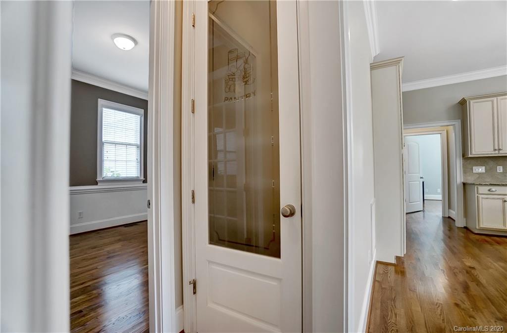 718 Revival Row Fort Mill, SC 29708 - Photo 23 of 47 a view of a hallway with wooden floor windows and livingroom