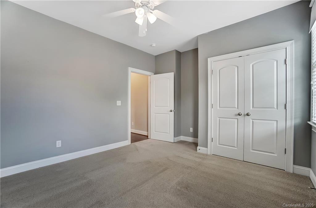 718 Revival Row Fort Mill, SC 29708 - Photo 34 of 47 an empty room with a chandelier fan