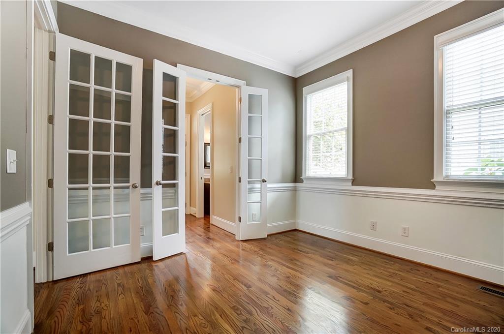 718 Revival Row Fort Mill, SC 29708 - Photo 6 of 47 an empty room with wooden floor and windows