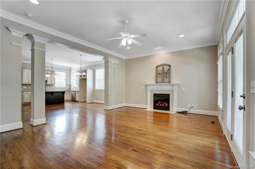 718 Revival Row Fort Mill, SC 29708 - Photo 8 of 47 a view of a livingroom with a fireplace a fireplace and wooden floor