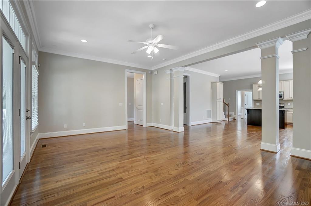 718 Revival Row Fort Mill, SC 29708 - Photo 9 of 47 a view of a hallway with wooden floor