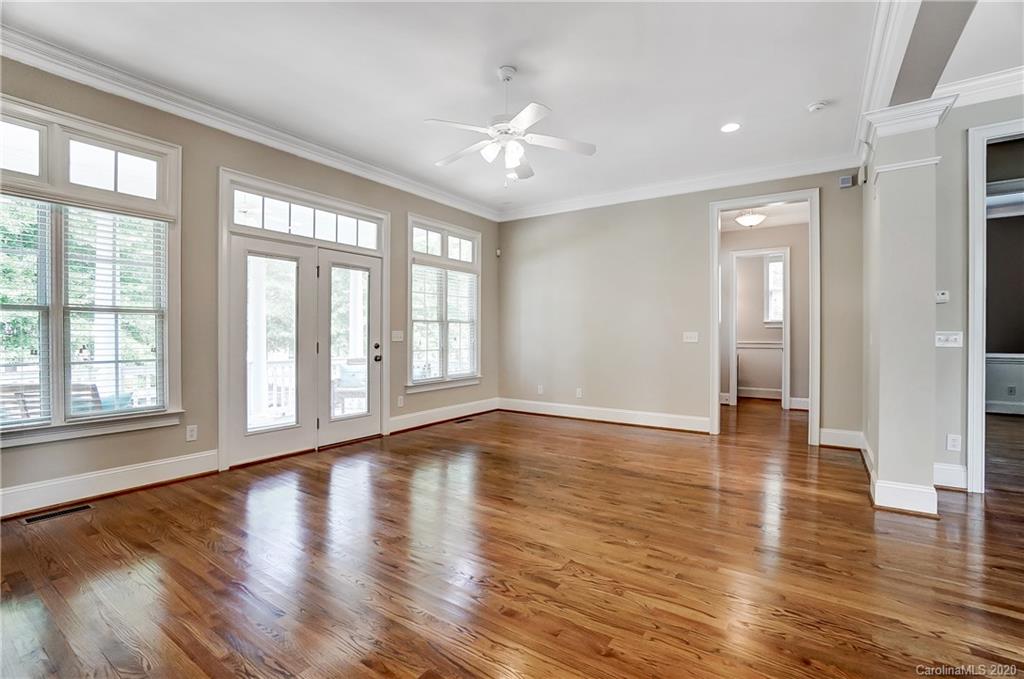 718 Revival Row Fort Mill, SC 29708 - Photo 10 of 47 a view of an empty room with wooden floor and a window