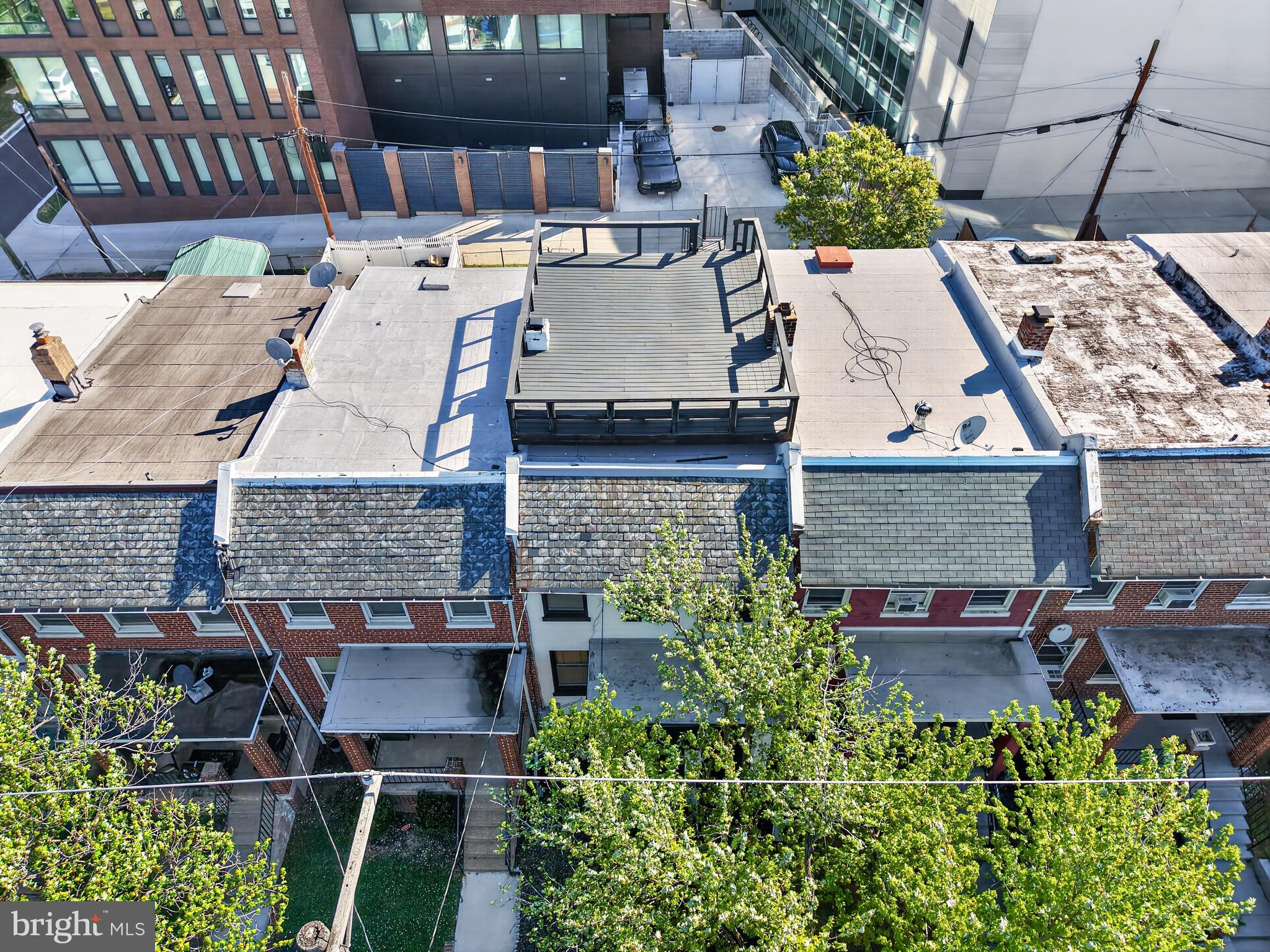 1118 Chicago Street Southeast Washington, DC 20020 - Photo 22 of 27 Urban rooftops with greenery below.