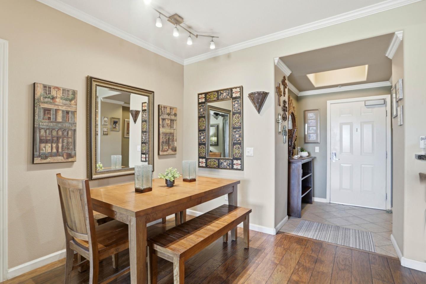 1310 Saddle Rack Street, Unit 314 San Jose, CA 95126 - Photo 13 of 43 a view of a dining room with furniture window and wooden floor