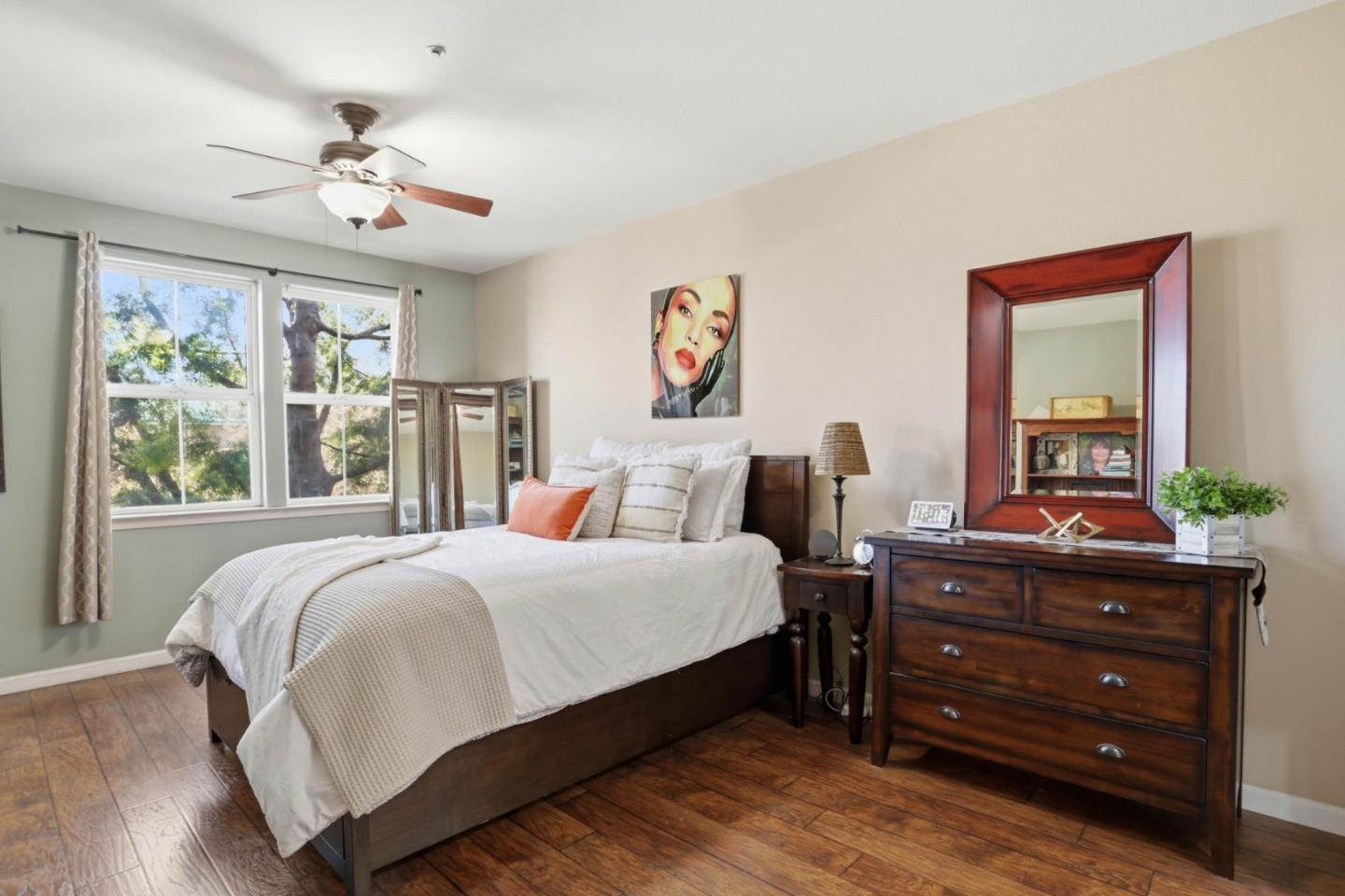 1310 Saddle Rack Street, Unit 314 San Jose, CA 95126 - Photo 16 of 43 a bed room with a bed and a dresser