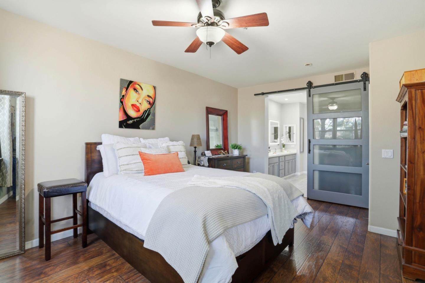 1310 Saddle Rack Street, Unit 314 San Jose, CA 95126 - Photo 17 of 43 a bedroom with a bed and a chandelier