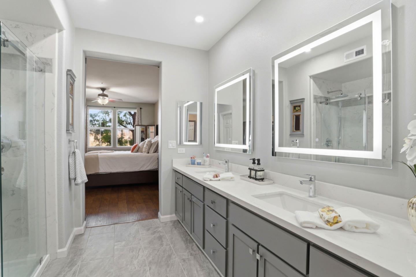 1310 Saddle Rack Street, Unit 314 San Jose, CA 95126 - Photo 20 of 43 a en suite bathroom with a double vanity sink and mirror
