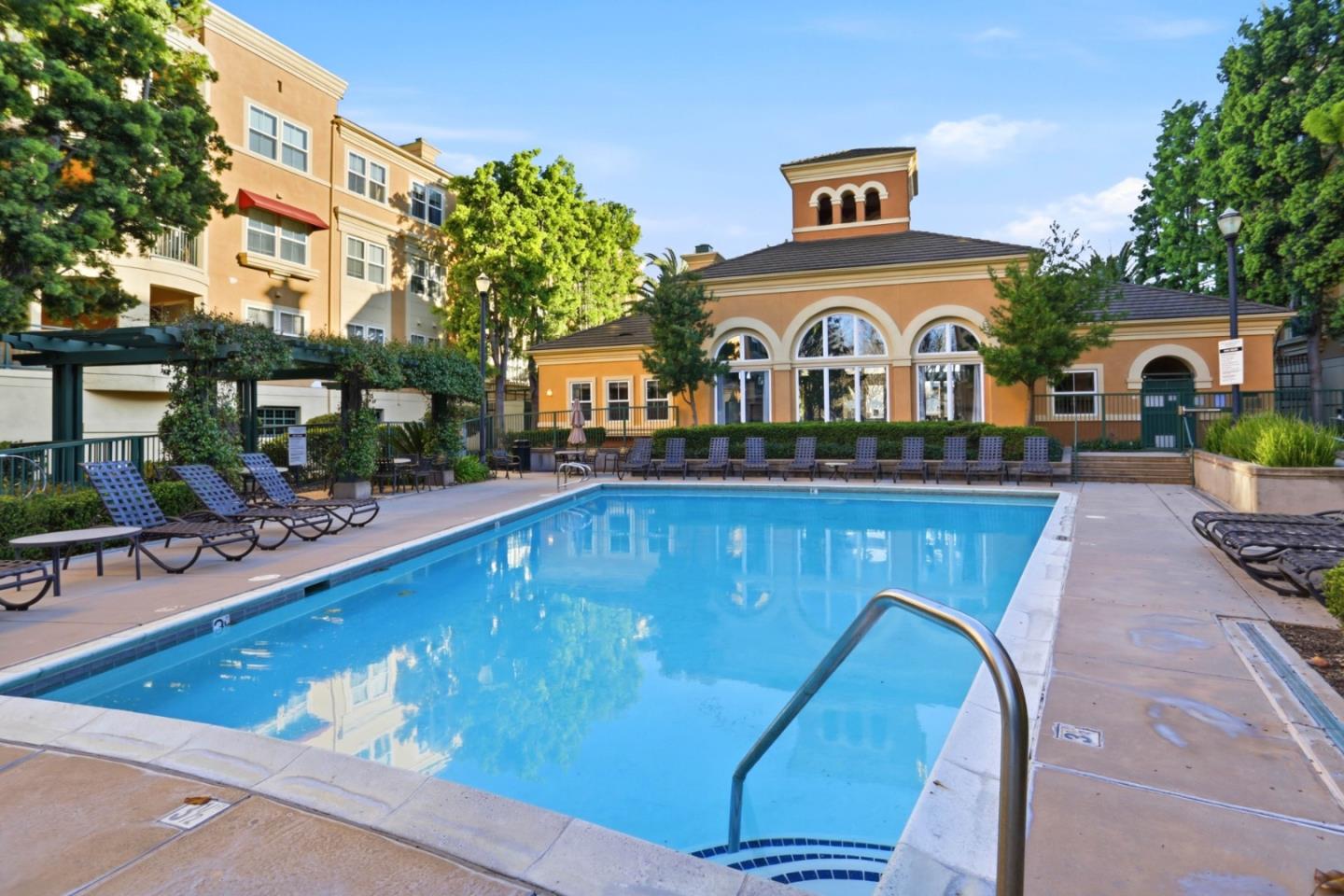 1310 Saddle Rack Street, Unit 314 San Jose, CA 95126 - Photo 37 of 43 a view of a large building with a large pool and windows