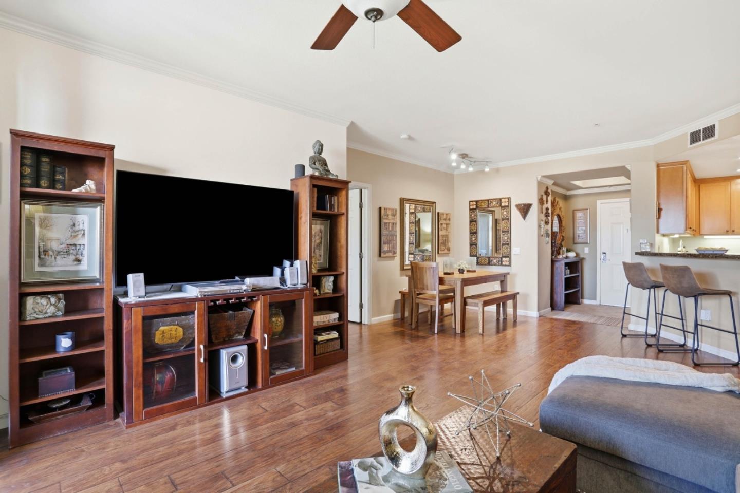 1310 Saddle Rack Street, Unit 314 San Jose, CA 95126 - Photo 4 of 43 a living room with furniture and a flat screen tv