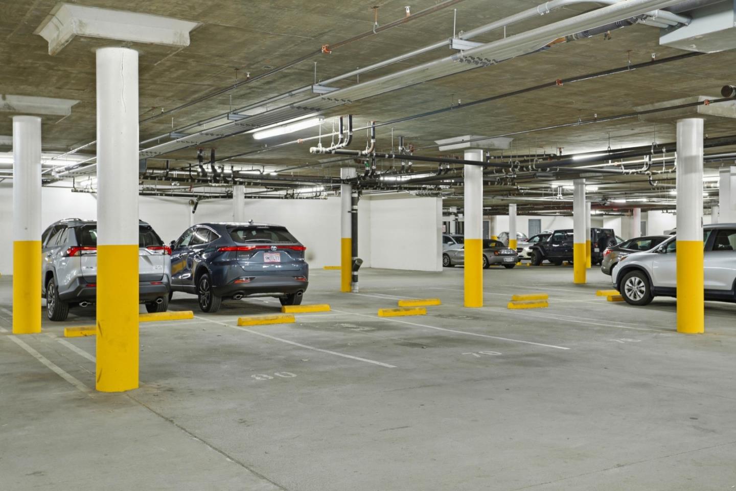 1310 Saddle Rack Street, Unit 314 San Jose, CA 95126 - Photo 42 of 43 a view of parking garage with cars