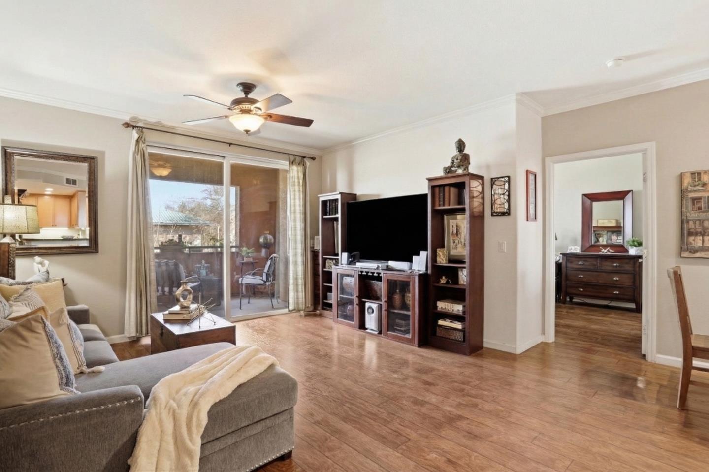 1310 Saddle Rack Street, Unit 314 San Jose, CA 95126 - Photo 5 of 43 a living room with furniture and a flat screen tv