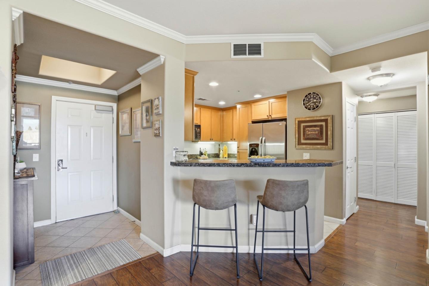 1310 Saddle Rack Street, Unit 314 San Jose, CA 95126 - Photo 6 of 43 a kitchen with stainless steel appliances granite countertop a refrigerator and a sink