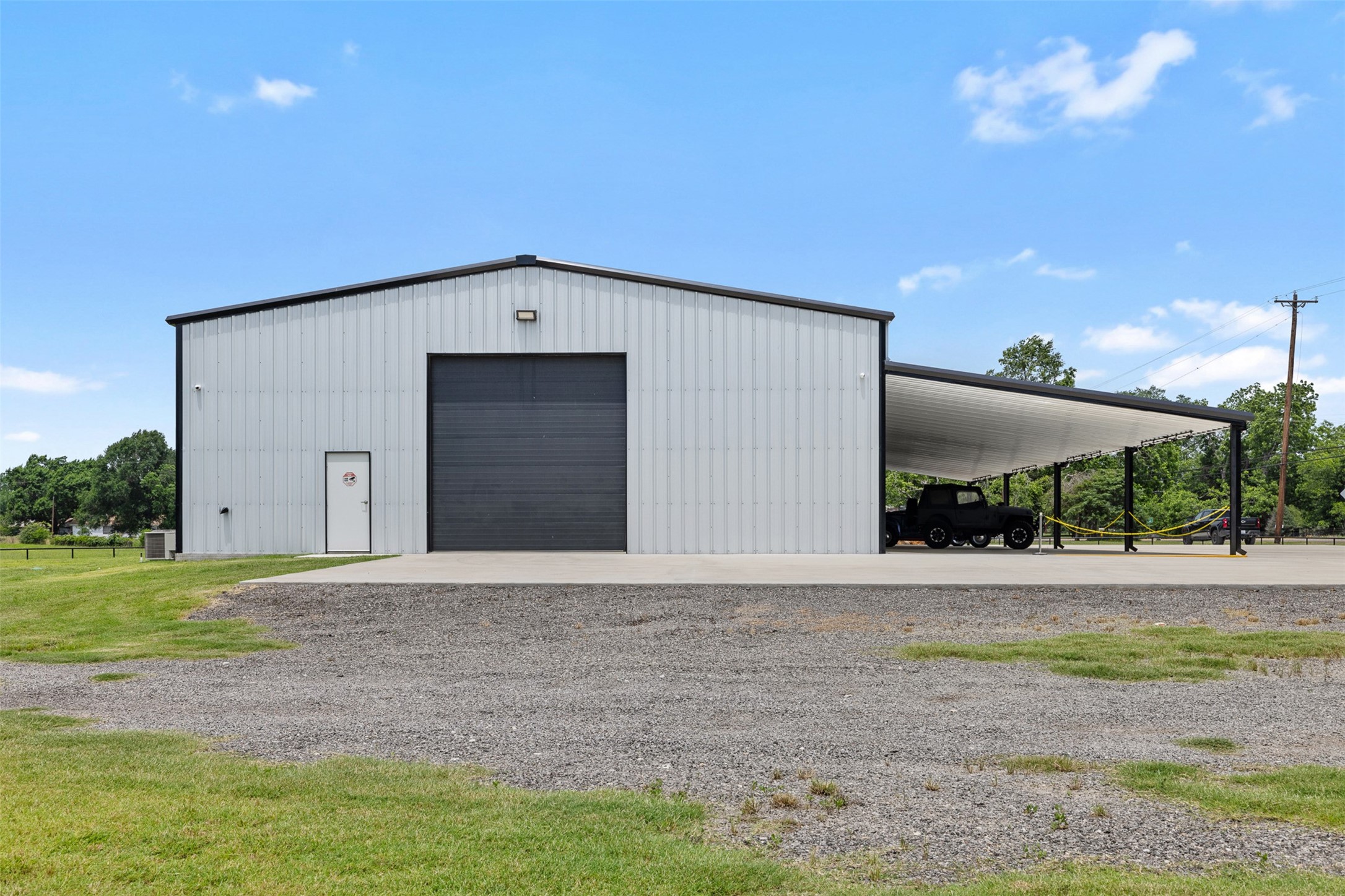 1229 Highway 36 Caldwell, TX 77836 - Photo 20 of 31 a front view of a house with a yard and garage