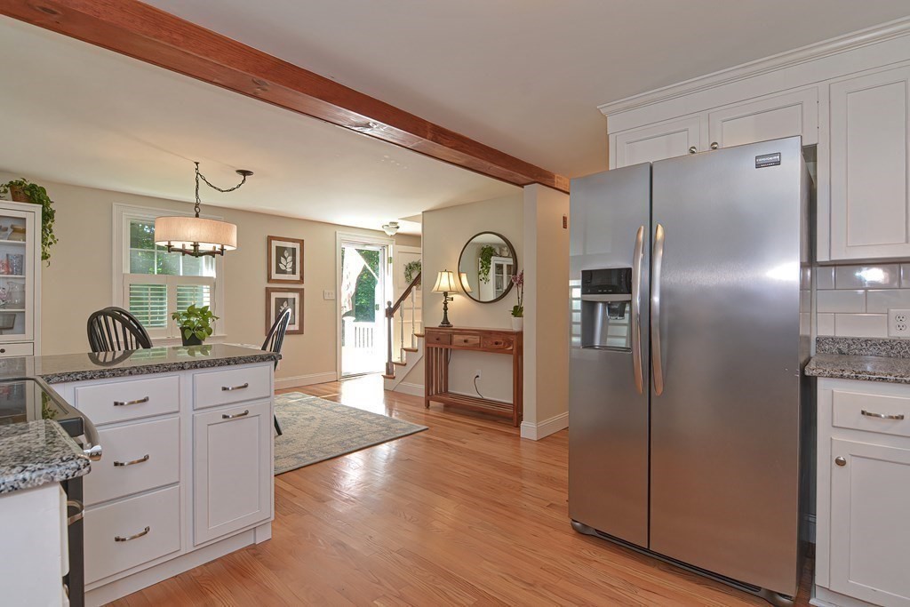 53 Warren Street Upton, MA 01568 - Photo 12 of 41 a kitchen with stainless steel appliances a refrigerator sink and cabinets