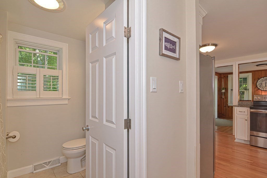 53 Warren Street Upton, MA 01568 - Photo 14 of 41 a bathroom with a toilet sink and a mirror