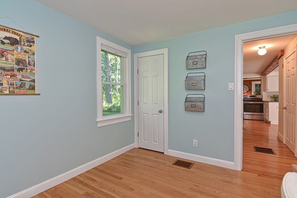 53 Warren Street Upton, MA 01568 - Photo 17 of 41 wooden floor in an empty room with a window