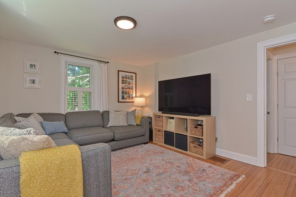 53 Warren Street Upton, MA 01568 - Photo 21 of 41 a living room with furniture and a flat screen tv