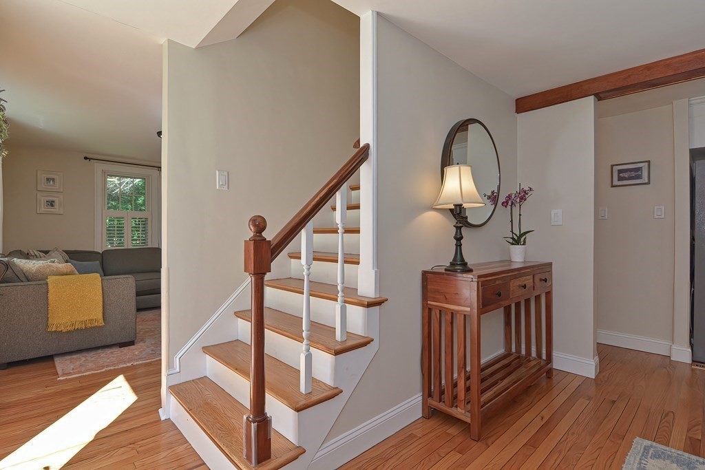53 Warren Street Upton, MA 01568 - Photo 22 of 41 a view of staircase with wooden floor and a rug