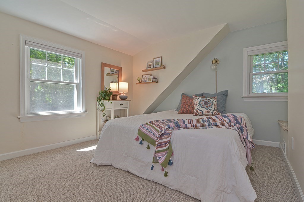 53 Warren Street Upton, MA 01568 - Photo 25 of 41 a bedroom with a bed and windows