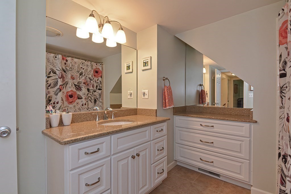 53 Warren Street Upton, MA 01568 - Photo 27 of 41 a bathroom with a granite countertop double vanity sink mirror and