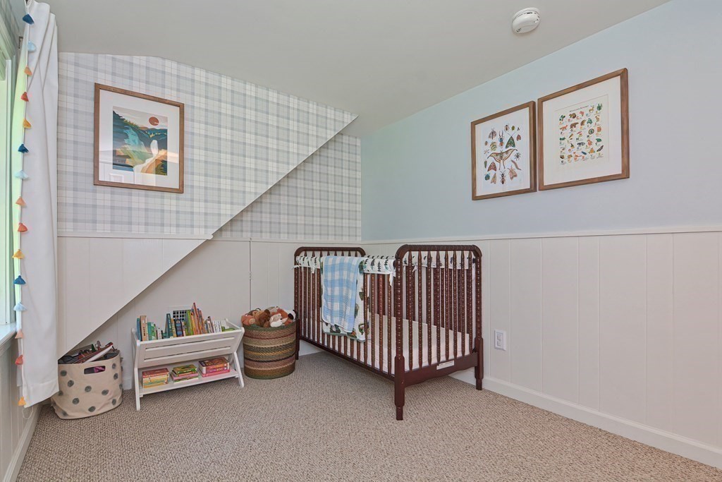 53 Warren Street Upton, MA 01568 - Photo 30 of 41 a room with stairs and a wooden floor