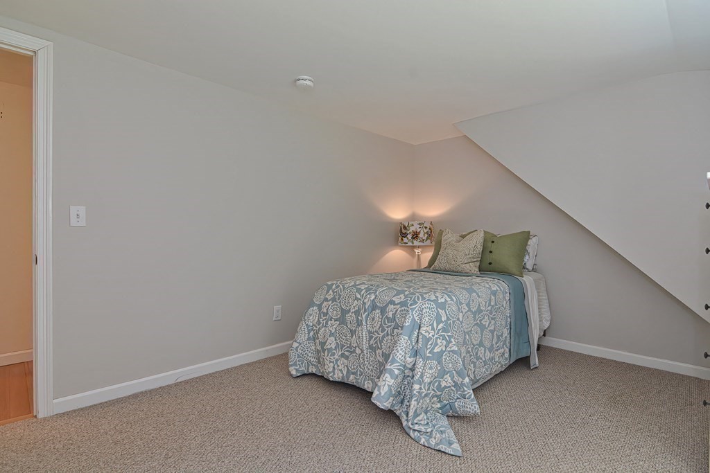 53 Warren Street Upton, MA 01568 - Photo 31 of 41 a bedroom with a bed and a window