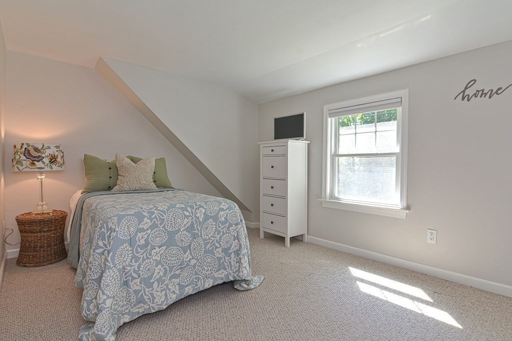 53 Warren Street Upton, MA 01568 - Photo 32 of 41 a bedroom with a bed and a window