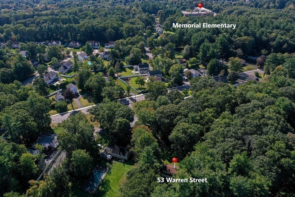 53 Warren Street Upton, MA 01568 - Photo 40 of 41 a view of a house with a yard and plants