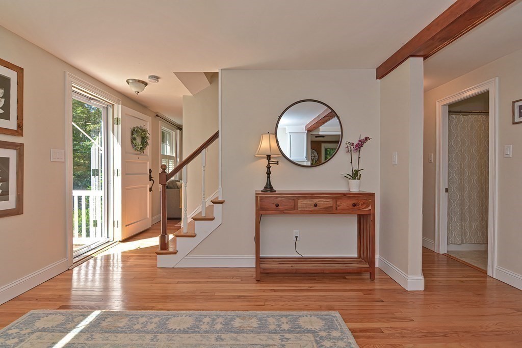 53 Warren Street Upton, MA 01568 - Photo 5 of 41 a view of entryway and hall with wooden floor