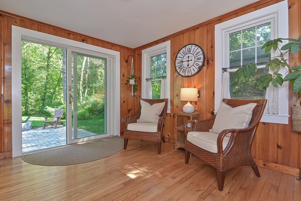 53 Warren Street Upton, MA 01568 - Photo 10 of 41 a living room with furniture a large window and a table