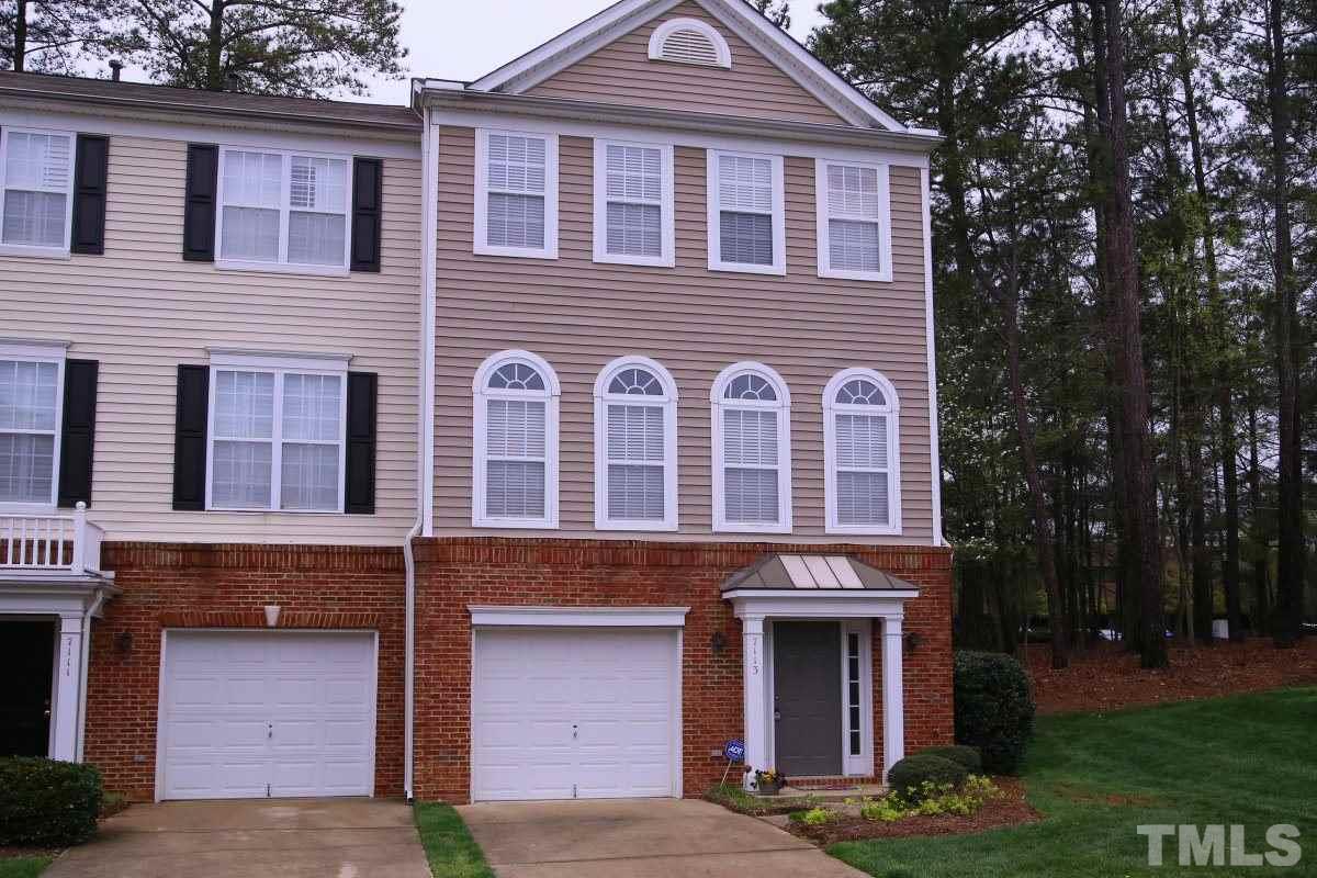 7113 Lovko Lane Raleigh, NC 27613 - Photo 1 of 25 a front view of a house with garden