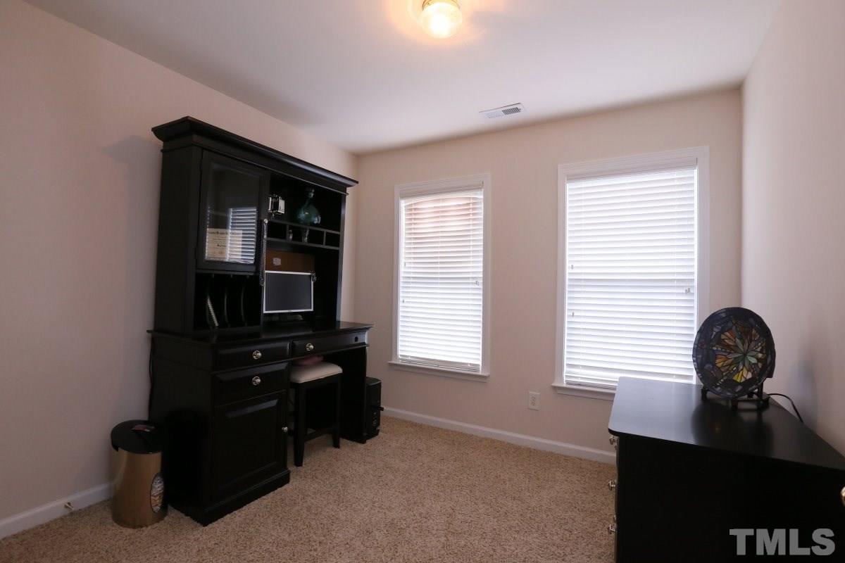 7113 Lovko Lane Raleigh, NC 27613 - Photo 16 of 25 a living room with furniture and a window