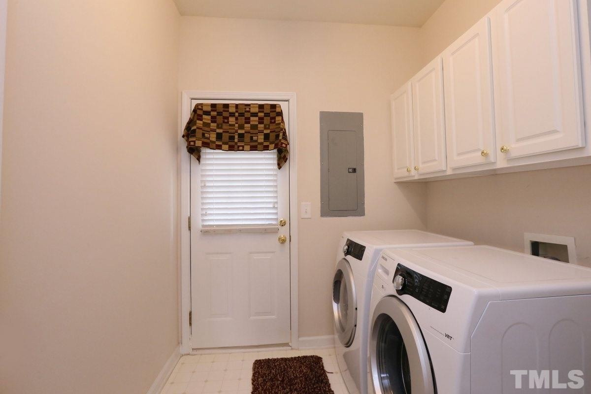 7113 Lovko Lane Raleigh, NC 27613 - Photo 21 of 25 a utility room with dryer and washer