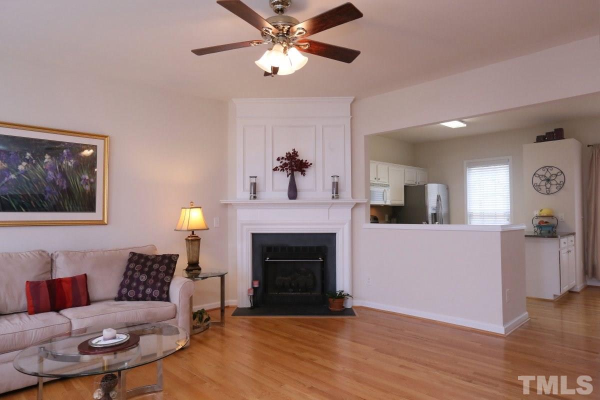 7113 Lovko Lane Raleigh, NC 27613 - Photo 6 of 25 a living room with furniture and a fireplace