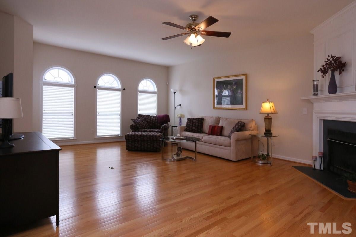 7113 Lovko Lane Raleigh, NC 27613 - Photo 7 of 25 a living room with furniture and a fireplace