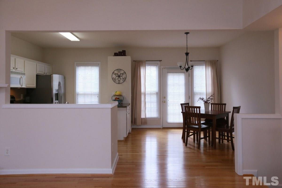 7113 Lovko Lane Raleigh, NC 27613 - Photo 8 of 25 a view of a dining room with furniture and window
