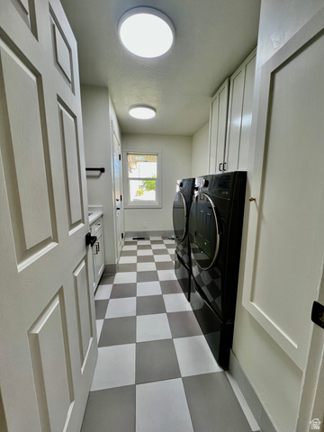 812 East Bates Cyn Road Tooele, UT 84074 - Photo 46 of 144 Laundry area featuring checkerboard flooring, a window providing natural light, built-in cabinetry, and recessed lighting